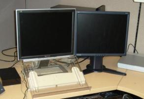If one monitor is used more than the other, then position that monitor in front of you and the other to the side.