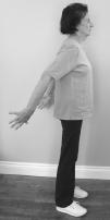 Overhead Reach Sit or stand with your head and back flat against a wall.