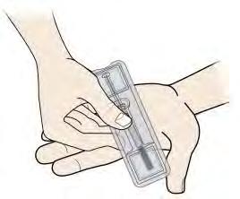 Turn the tray over and gently press the middle of the tray s back to release the syringe into your palm.