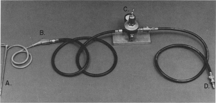 Attachment which has 16-gauge jet at~xed; C, Blowgun; D, Pressure reducing valve; E, Schraeder connector.