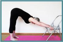 Adho Mukha Svanasana 1 for Beginners Hold the sides of the chair firmly and walk your feet slowly back until your body and arms are at full stretch, your legs are vertical with your feet hip width