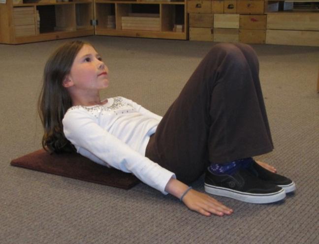 SIT UPS Lie on the ground on your back and bend your knees so your knees point up toward the ceiling.