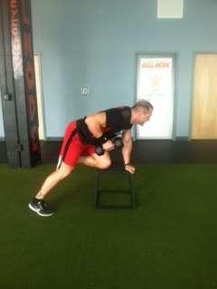 Pull dumbbell up to side until it makes contact with ribs or until upper