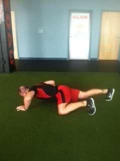 2. Then move your right arm forward, and then bring your right knee toward your right arm and perform another push-up.