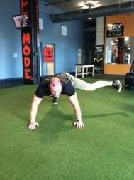 Starting in front plank position, kick