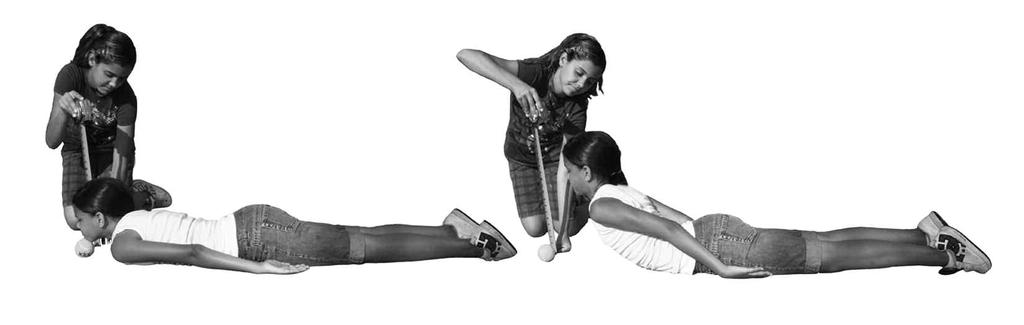 On the teacher's command, students in one group perform the Shoulder Stretch with the right hand over the shoulder.
