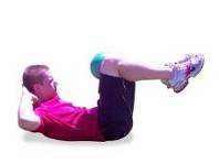 E3 MB Double Cr - Lie down on the floor with your knees bent. Hold a medicine ball between your knees.