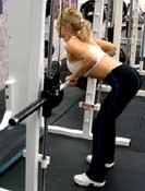 Equipment: Machine Tips: Straddle a T-bar rowing machine with your feet firmly on the ground.