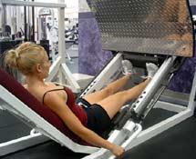 Tips: While sitting a leg press machine, press the weight rack up as if you were going to do a leg press.