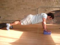 Exercise Descriptions 4-Minute Elevated Extension Elevated Pushups Keep the abs braced and body in a straight line from knees to shoulders.