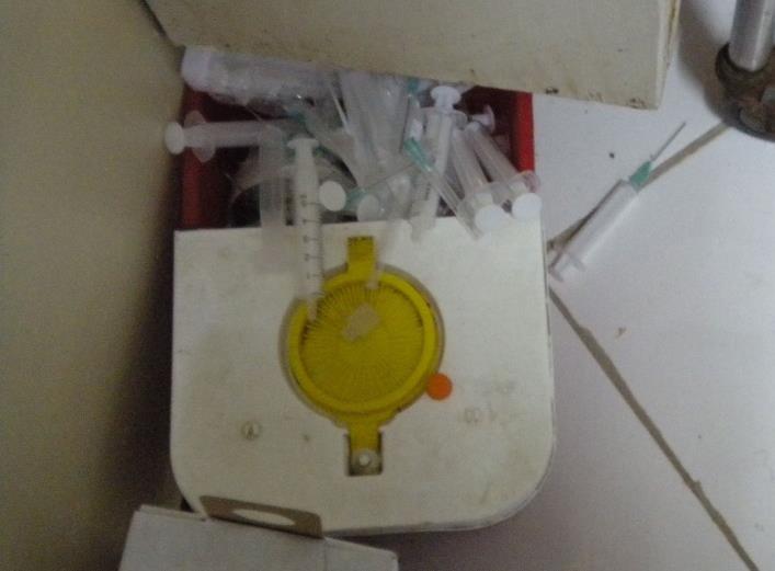 Overflowing safety boxes Needles on the floor around the safety box Used needles left on trolleys Needles being resheathed Unsheathed needles being passed from doctor to nurse Needles being reused