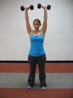 Military Press How To: Stand with a dumbbell in each hand at shoulder height, palms facing forward.