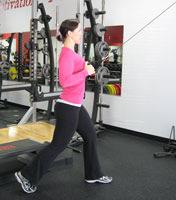 Standing Split Stance Cable Row How To: Standing facing a high cable pulley with handles attached split your legs into a split stance with one foot in front of