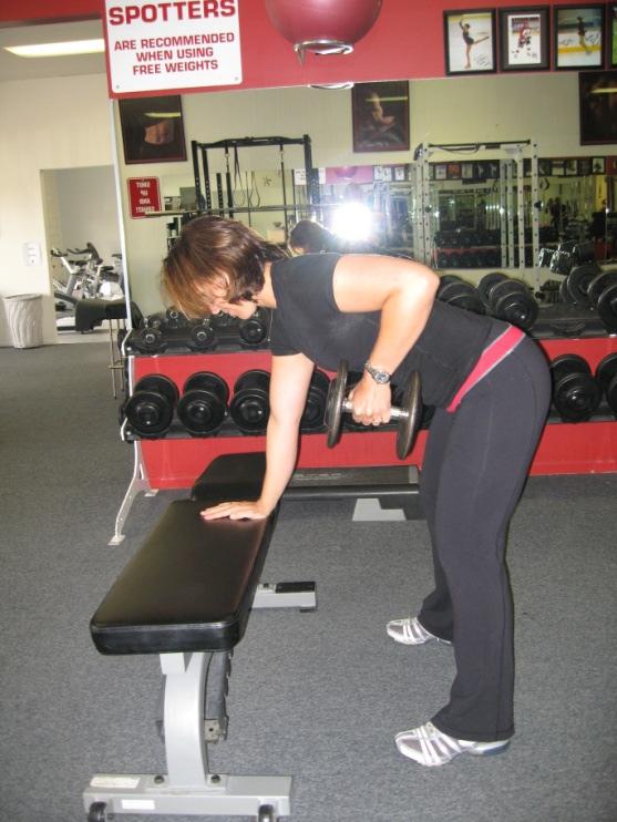 Grab a dumbbell in one hand and bend forward to approximately a 45 degree angle, head in neutral, knees bent to twenty degrees (this activates the iliotibial band and
