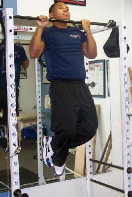 Alternate grips each set for muscular balance. If this exercise becomes too easy add a dumbbell or plates with a chinning belt. If the exercise is too hard perform pull downs.