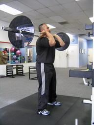 Front Squats How To: Place the bar as high on your neck as comfortable.