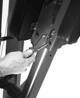 resistance. Use the squat attachment by squatting under the handlebars with the shoulder pads resting on your shoulders.