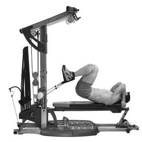 Keep abs tight during entire motion. Lie on the bench, head toward the Power Rod units, grasp bench for support.