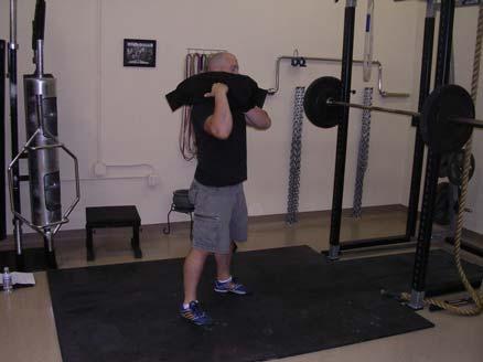 Shouldering Shouldering is performed by straddling the bag with slightly bent knees, flexed hips, and a neutral spine