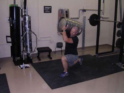 Shoulder the keg as explained above and then perform a lunge.