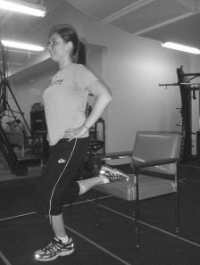 Extend your left leg behind you and keep your heel flat on the floor during the stretch.