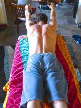 Release tension and bring arms overhead, pull shoulder blades down and in, towards opposite hip.