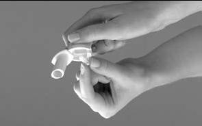 2. Open the inhaler - Hold the bottom of the inhaler firmly with one hand.