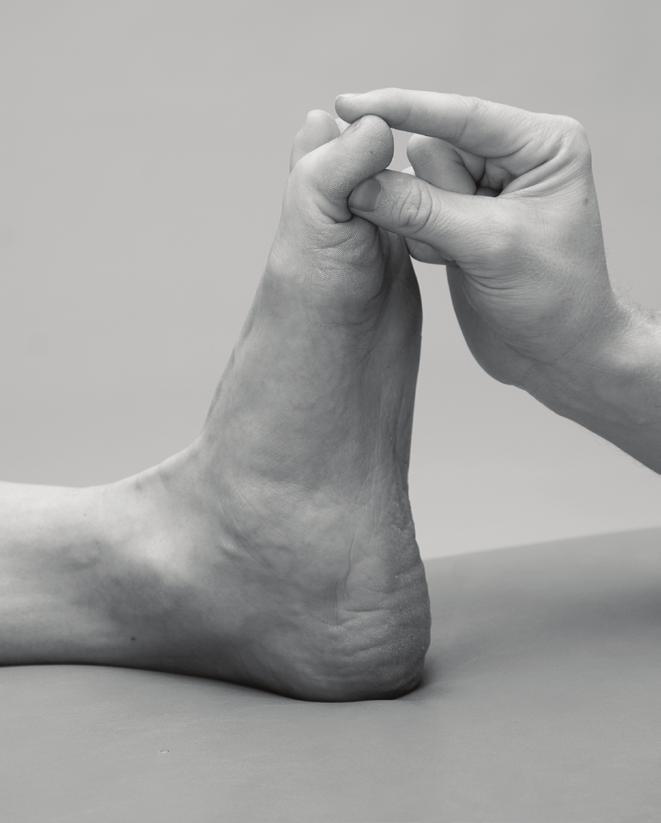 Hold the end of your toe and slowly bend the toe downwards 