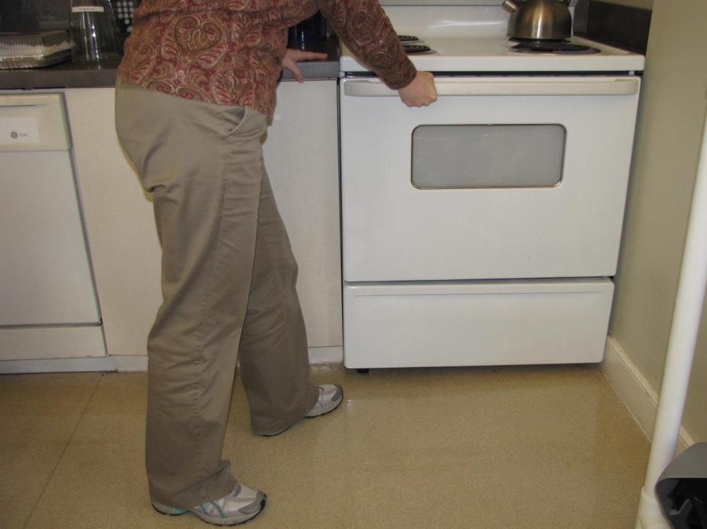 To help avoid falls in the kitchen when opening cabinets, refrigerator, or oven: 1-stand to the side of what you