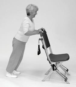 3 feet behind chair. 2. Place hands on back of chair as shown. () 3. Bend elbows to slowly lower chest towards chair. () 4.