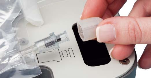 Using aseptic technique, remove the cap from the solution syringe by turning the