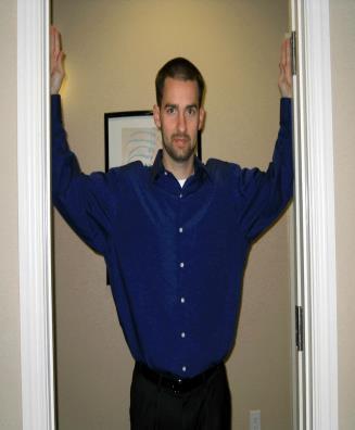 Pec Stretch Doorway: Stand in a doorway with the inside of each bent arm on the surface of the wall. Position the bent elbow at shoulder height.