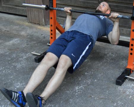 Inverted Bodyweight Row Assistance Work Any time we can work torso stability into another exercise and force athletes to transmit force from their feet to their hands through their torso, I m all in.
