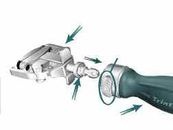 Triathlon Single-Use Instrumentation Femoral Impactor/Extractor, Impaction Handle and Femoral Trial or Femoral Component Assembly: > Snap the Femoral Impactor/Extractor into the Impaction Handle.