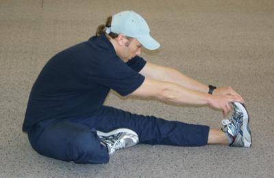 forwards into the right leg stretching the