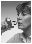 4 Hold the inhaler upright with your thumb on the base, below the
