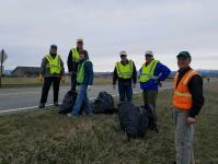 miles north of the blinking light on Highway 12. This project involves picking up garbage three times a year.