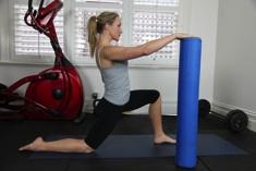Hip flexor stretch 1. Using the upright foam roller as support, place one leg forward into a lunging position. Keep the front knee over the ankle (picture 1). 2.