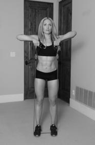 ) In a standing position, position the feet over top of the middle of the resistance band. 2.