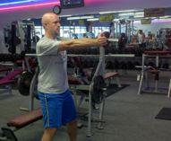 Hold a single Kettlebell or dumbbell in both hands in front of your body at arm s length.