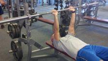Keep your body tight and lower the bar to your chest.