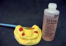 Combination dentures Apply two thin layers of Al-Cote separating agent to the dry cast.