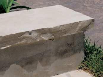 treads). The stucco wall is capped with Lompoc Oatmeal Wall Cap 10 width.