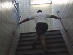 Here I m on pulling on the stair rails using what I call a crossover forward. The main point is that I m using the handrails to propel me forward.