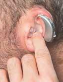 At this point you may need to pull down your earlobe with your other hand.