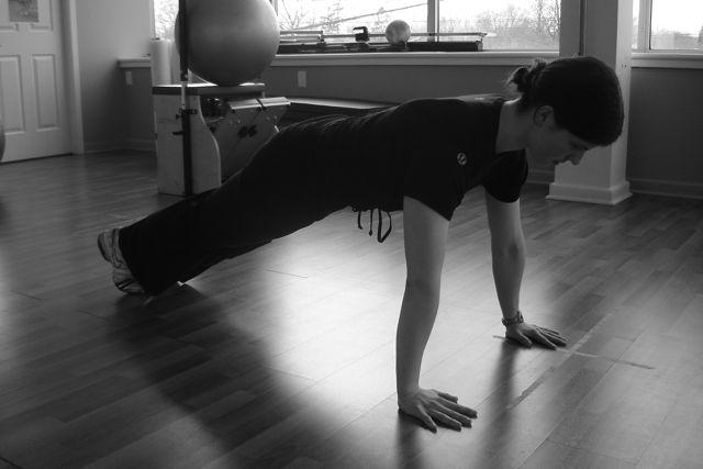 of the push-up position. Now swing the right foot forward to stretch out the inside of the right leg.