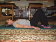 Supine Butt Lift with Arms at Side Lie on your back on table or mat with hips and knees bent to 90 degrees with feet flat on floor and arms palm-down at sides; draw in