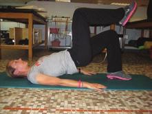 Supine Single Leg Butt Lift Lie on your back on table or mat with hips and knees bent to 90 degrees with feet flat on floor and arms palm-down at sides; draw in abdominal