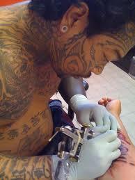 Tattooing & Body Piercing In tattooing, a pigment is deposited with a needle in the dermis Body