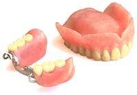 Gently hold the denture over the sink and brush all parts of the denture.
